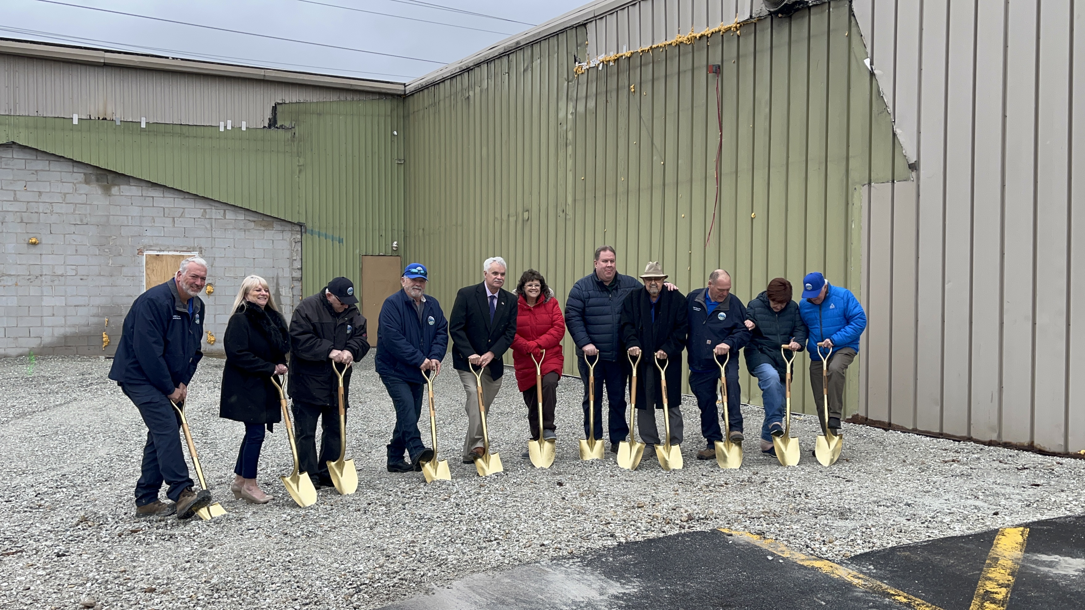 Hodgkins Village Board breaking ground with gold shovels at DPW building.